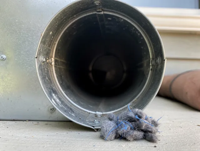 Fallbrook Dryer Vent Cleaning technician using specialized equipment to clear severe dryer vent blockage in Fallbrook